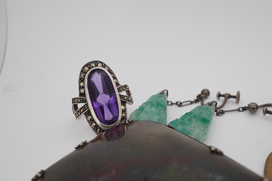 A small group of Victorian and later jewellery, including a white metal mounted bloodstone brooch, 57mm, lave cameo, rings, etc.